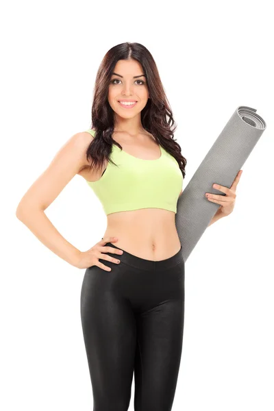 Woman holding an exercise mat — Stock Photo, Image