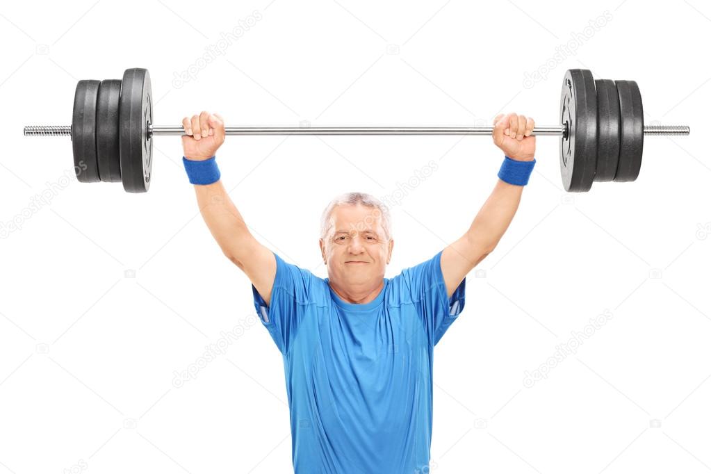 Mature man holding heavy weight
