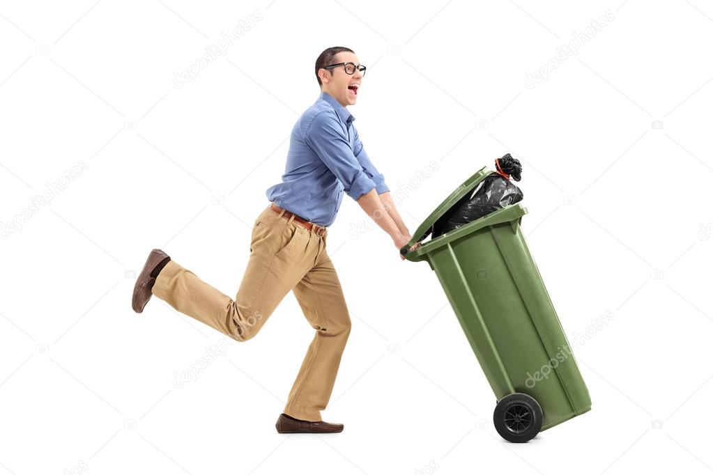 Excited man pushing garbage can