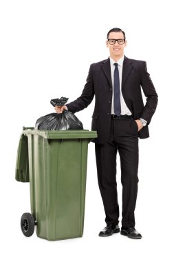 Businessman taking out trash clipart