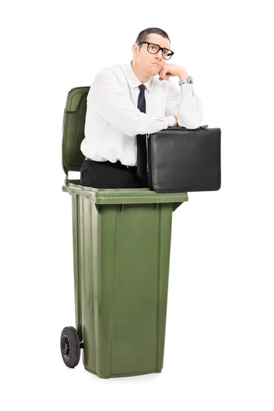 Businessman in a trash can — Stock Photo, Image