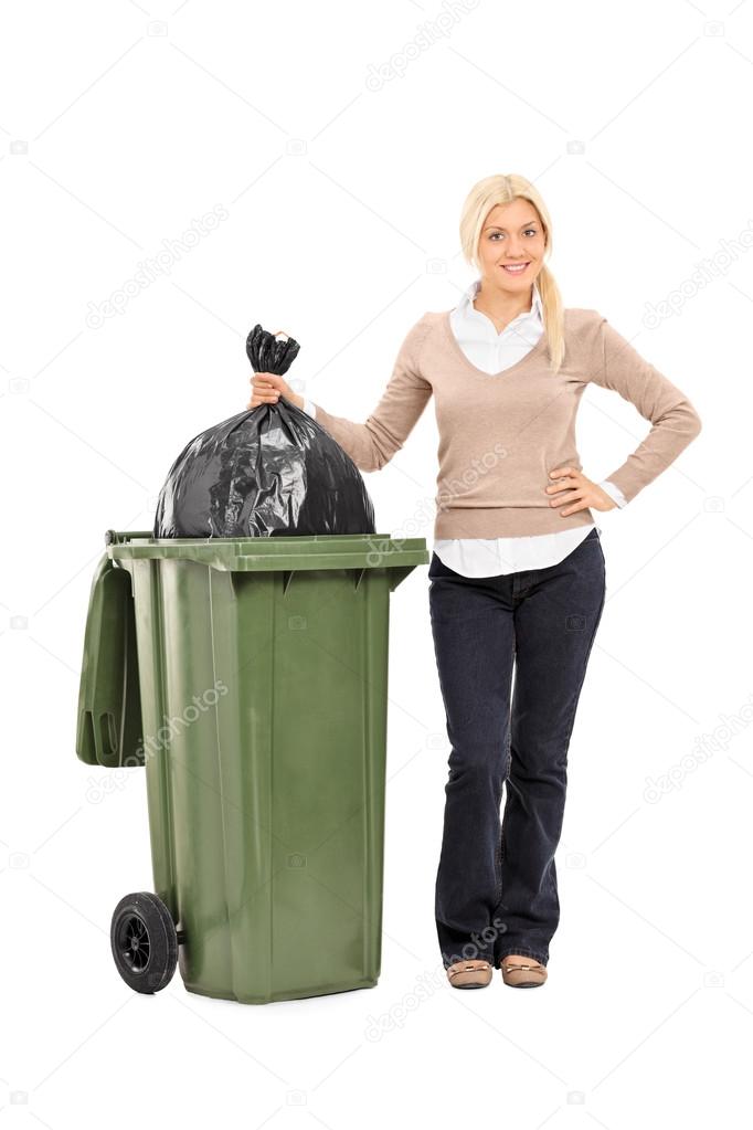 Woman throwing out the trash