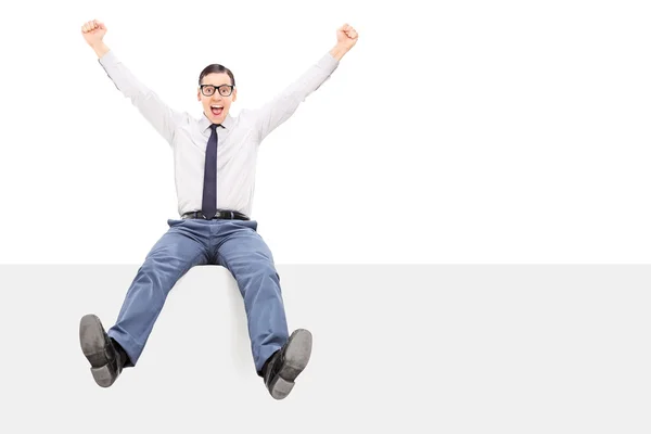 Happy guy sitting on panel — Stock Photo, Image