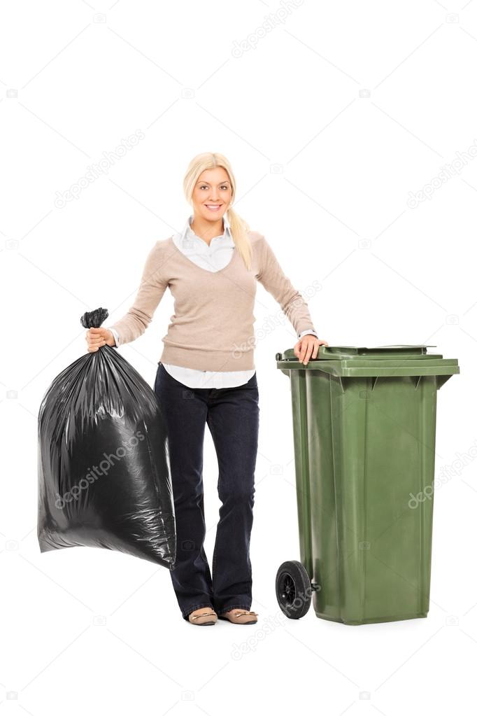 Woman holding trash bag