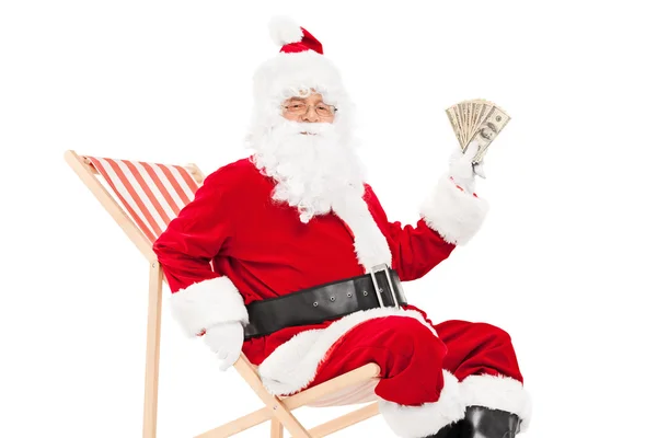 Santa sosteniendo dinero — Foto de Stock