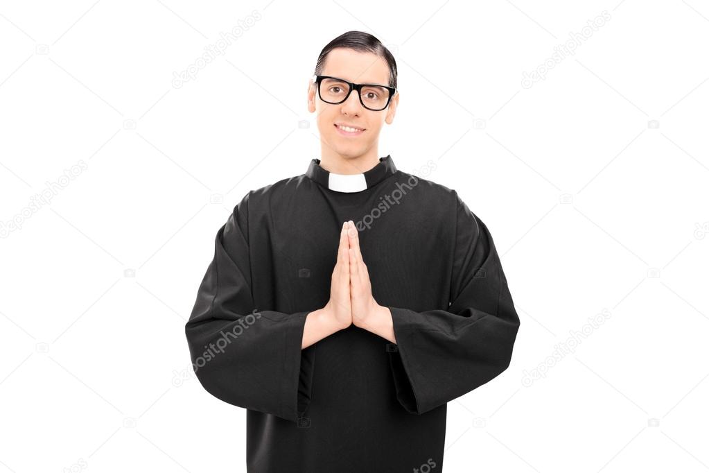 Young priest praying