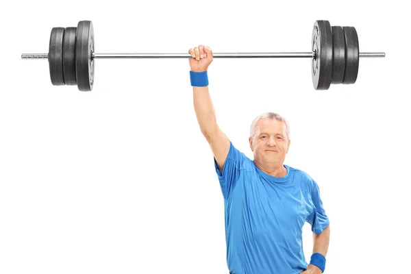 Senior hält Gewicht in einer Hand — Stockfoto