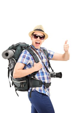 Male tourist giving thumb up clipart