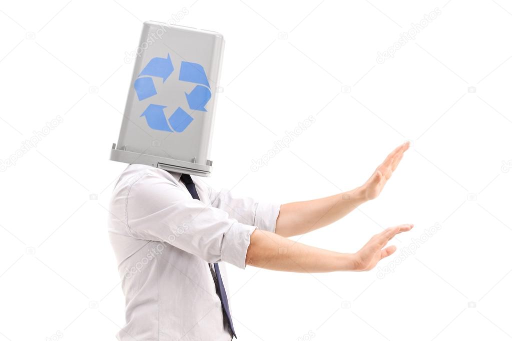 Man with recycle bin over head