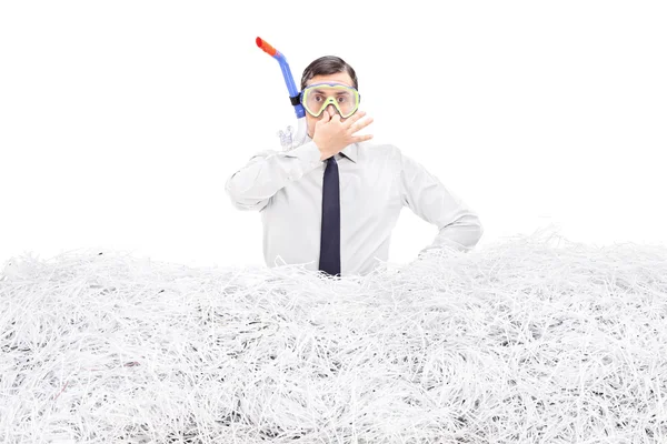 Businessman diving into shredded paper — Stock Photo, Image