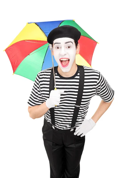 Mime artist holding colorful umbrella — Stock Photo, Image