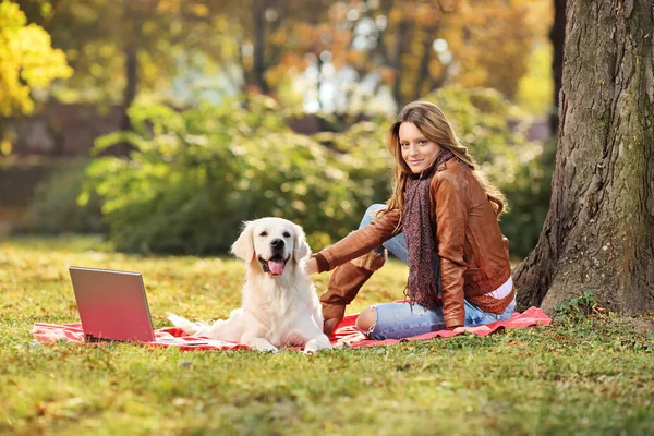 Girl with dog in park — Stock Photo, Image