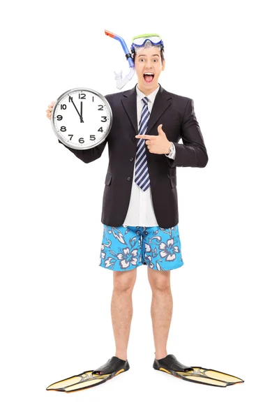 Businessman with snorkel holding wall clock — Stock Photo, Image