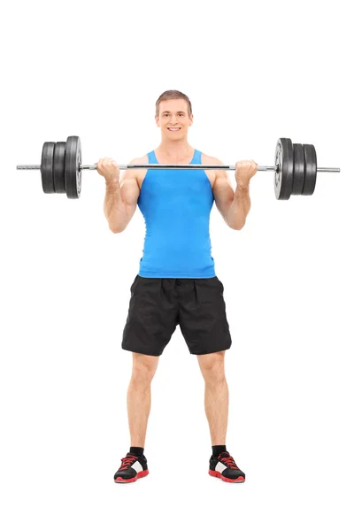 Male bodybuilding lifting a barbell — Stock Photo, Image