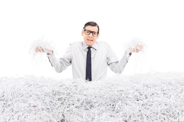 Powerless employee holding shredded paper clipart
