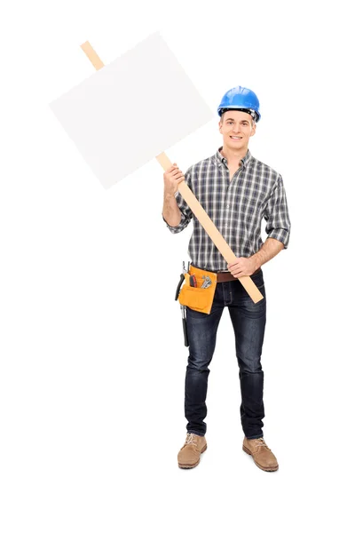 Construction worker holding blank sign — Stock Photo, Image