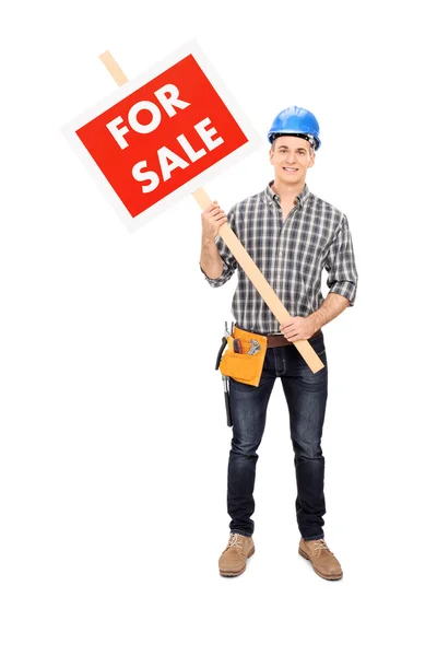 Engineer holding for sale sign — Stock Photo, Image