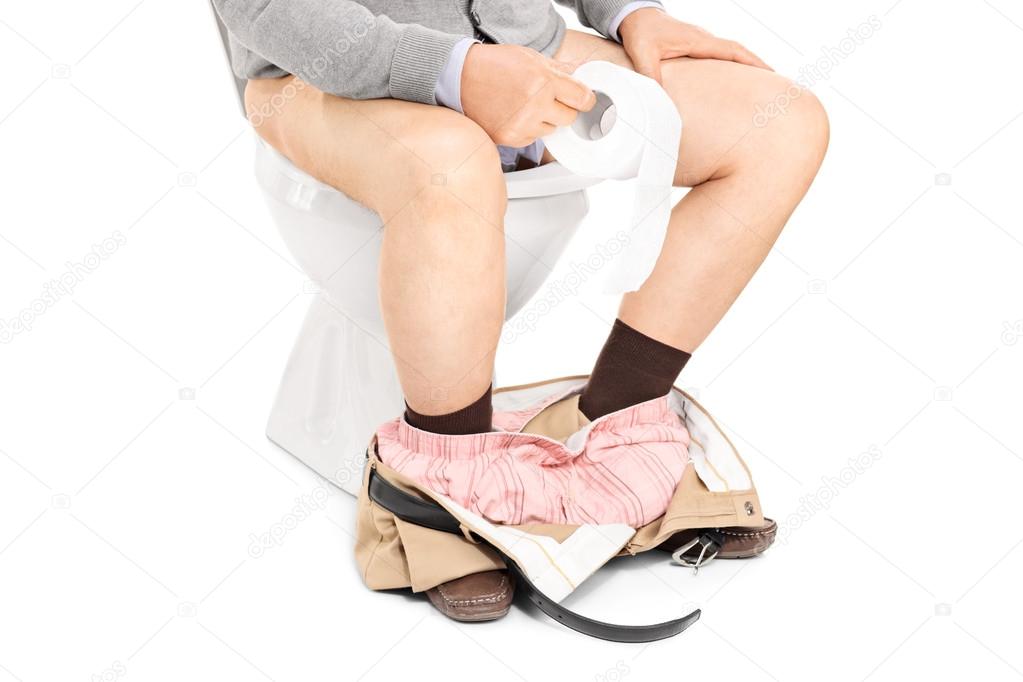 Man sitting on a toilet