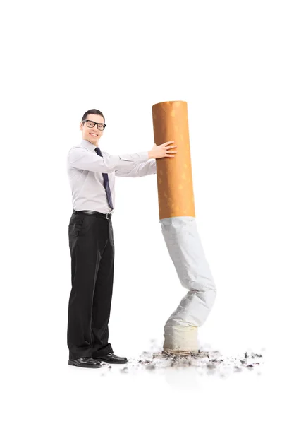 Handsome man putting out cigarette — Stock Photo, Image