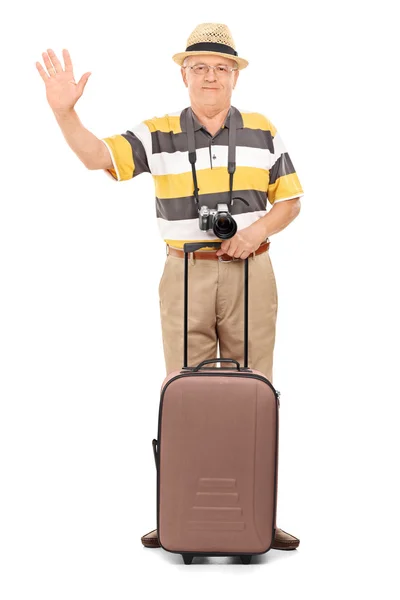 Mature tourist waving with hand — Stock Photo, Image