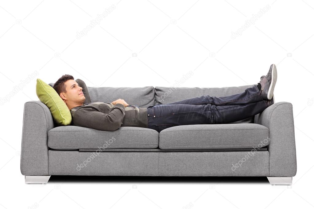 Young guy laying on sofa