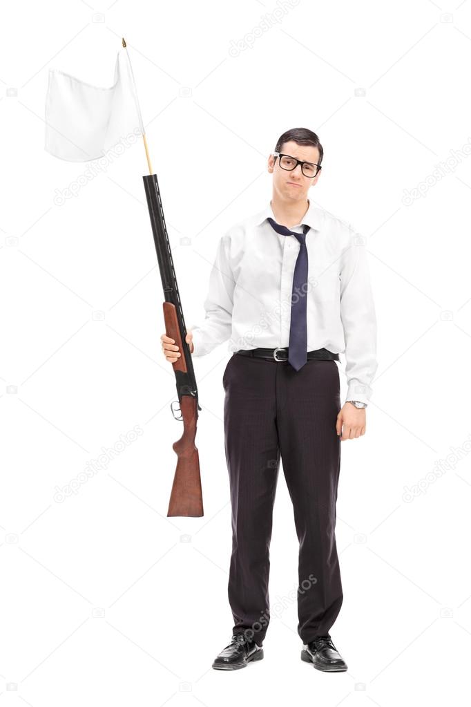 Businessman holding rifle with flag