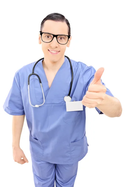 Young doctor giving thumb up — Stock Photo, Image