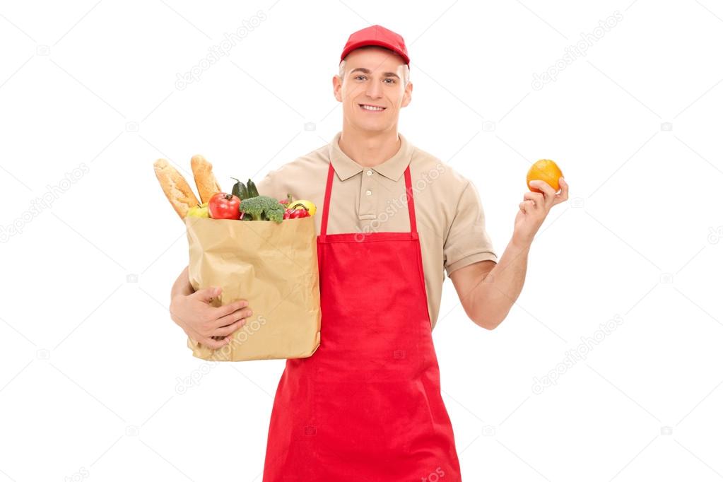 Retail worker holding grocery bag