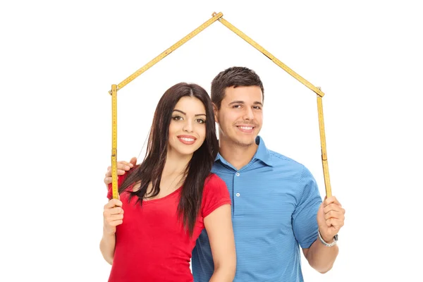 Couple making roof over heads — Stock Photo, Image