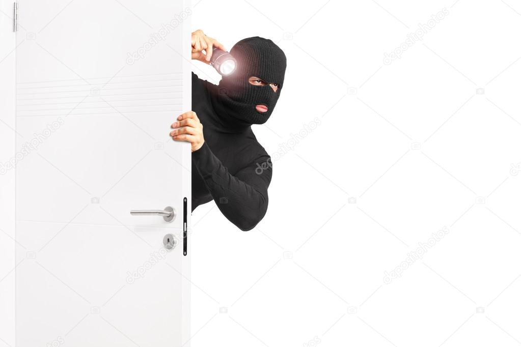 Burglar entering through door