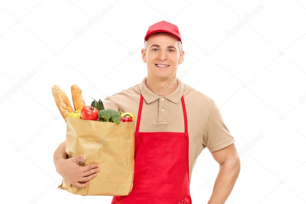 Market vendor holding grocery bag