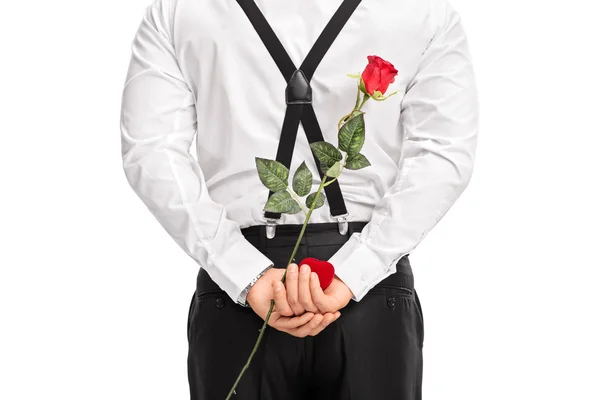 Man holding flower and box — Stock Photo, Image