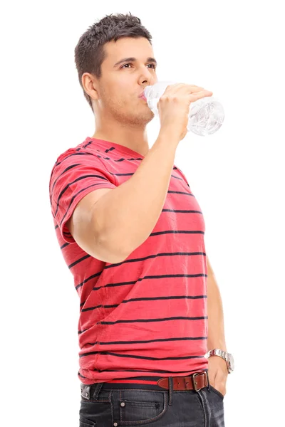 Young man drinking water — Stock Photo, Image