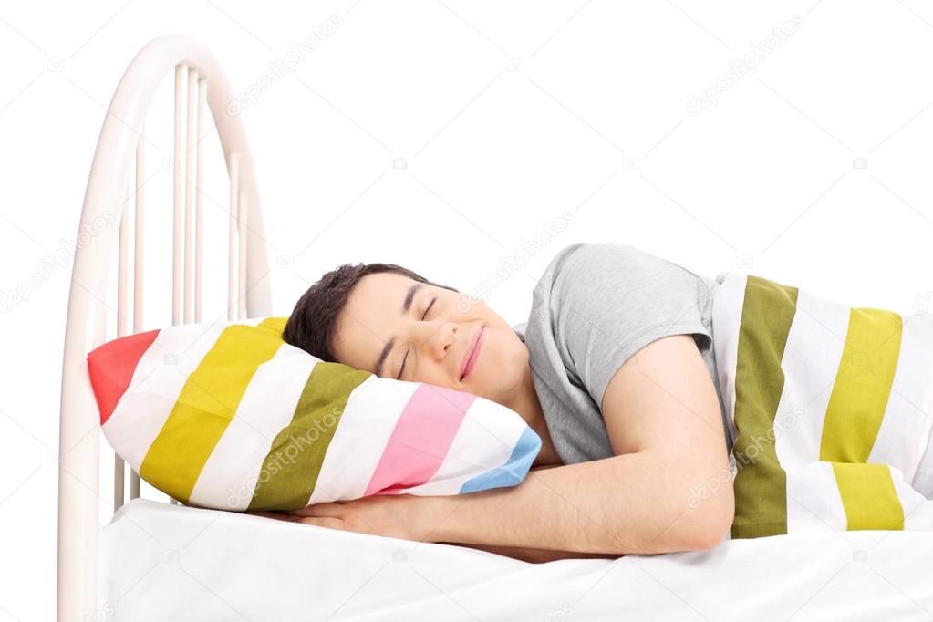 Carefree man sleeping in bed