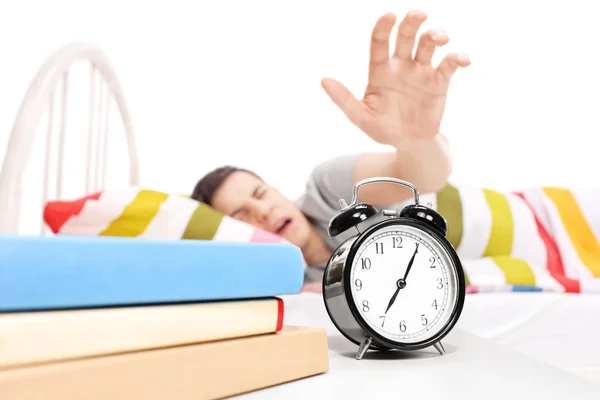 Man reaching for alarm clock — Stock Photo, Image