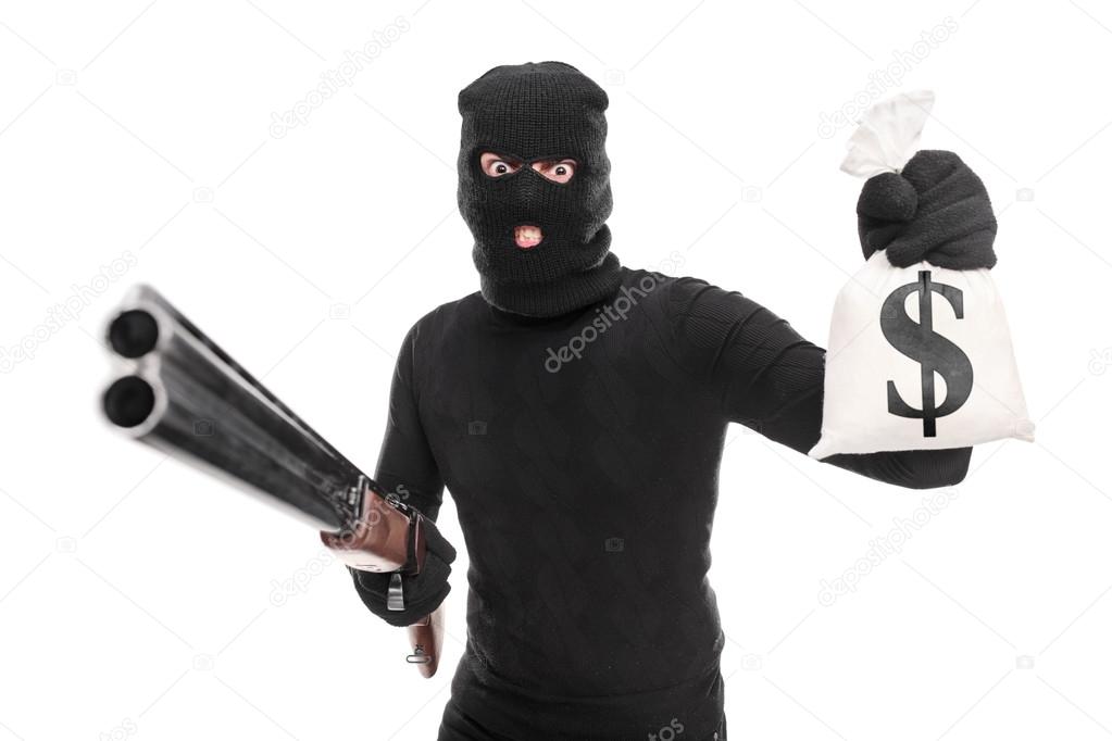 Burglar holding money and shotgun