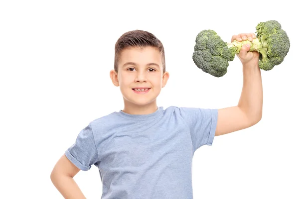 Little boy with broccoli dumbbell — Stock Photo, Image