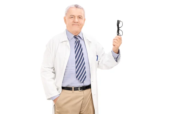 Mature doctor holding glasses — Stock Photo, Image