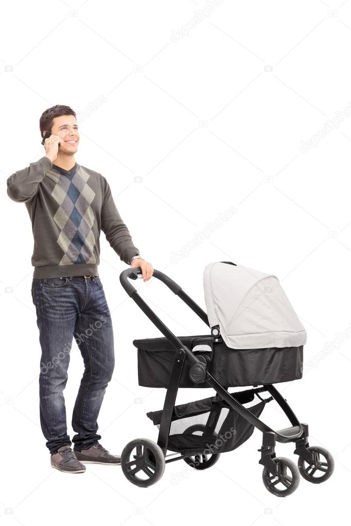 Father pushing a baby stroller