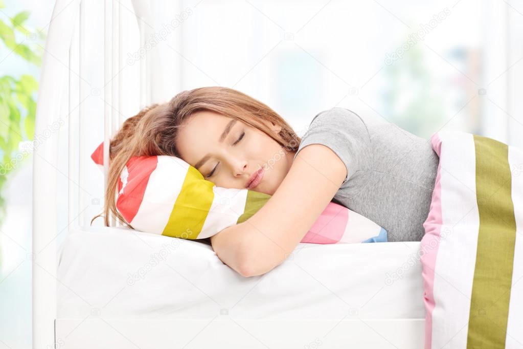 Beautiful woman sleeping in a bed