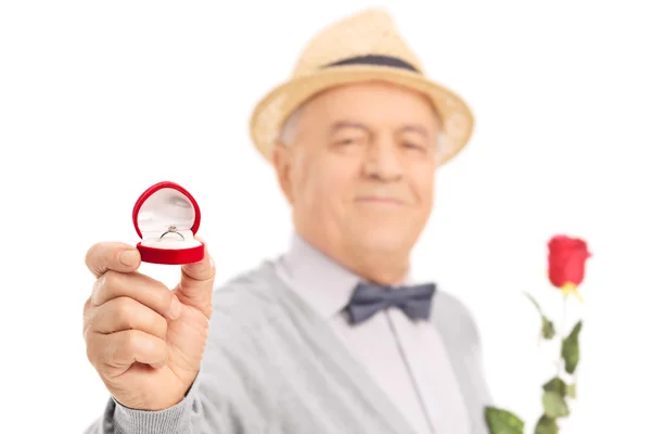 Senior gentleman holding engagement ring — Stock Photo, Image