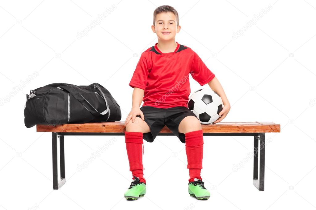 Junior soccer player on bench
