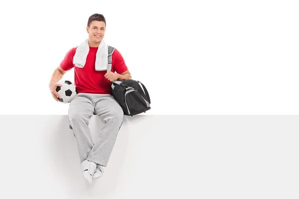 Football player on blank billboard — Stock Photo, Image