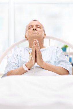Male patient praying to god clipart