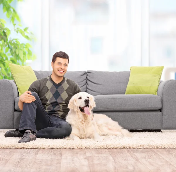 Man on the floor with dog — Stock Photo, Image