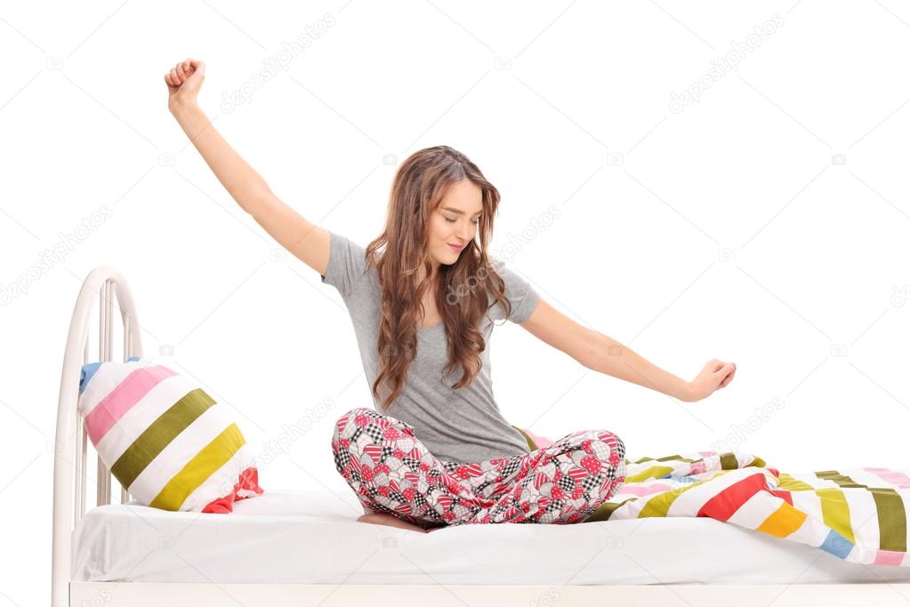 Woman waking up and stretching