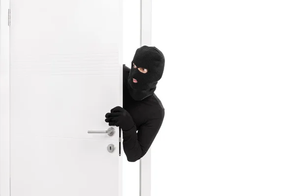 Thief breaking into a room — Stock Photo, Image