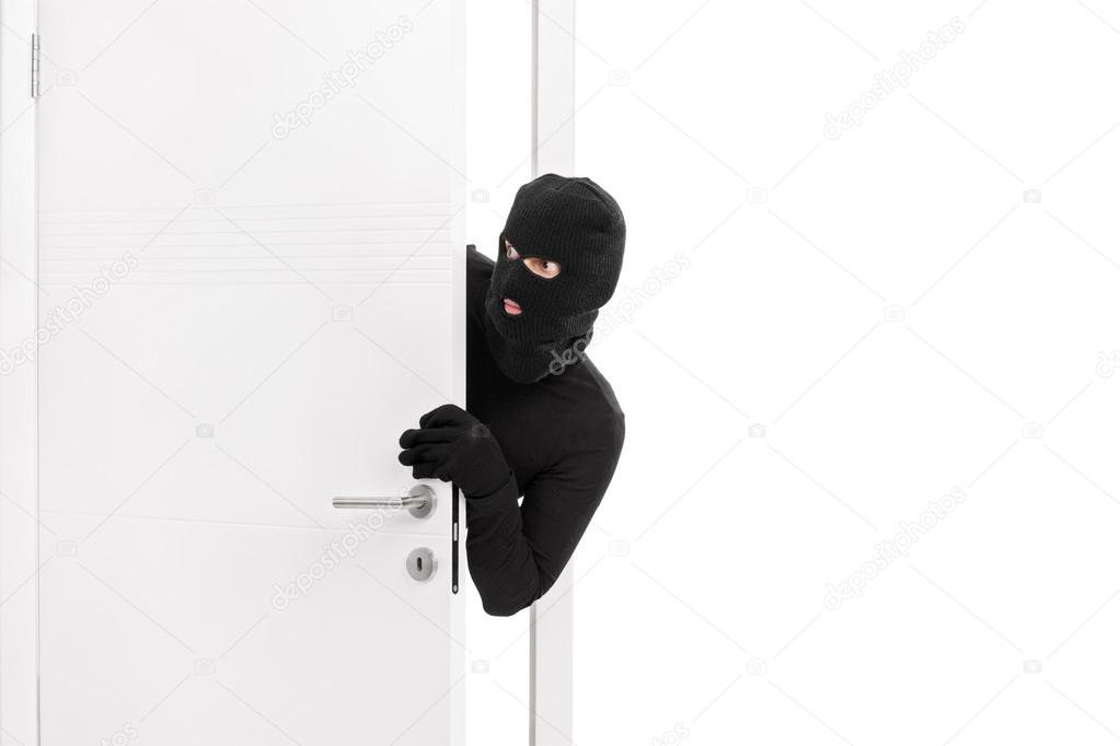 Thief breaking into a room