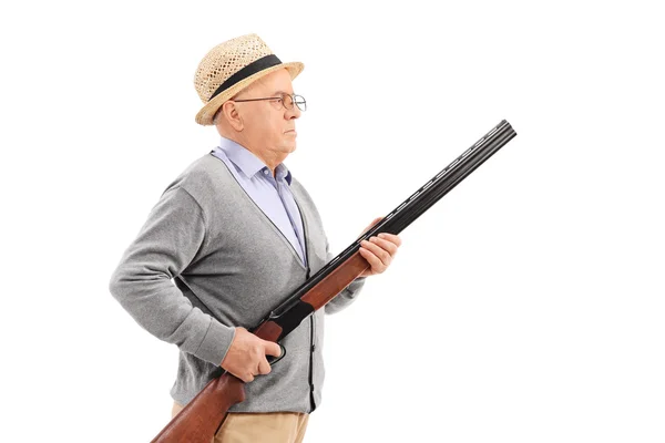 Un signore anziano con un fucile — Foto Stock
