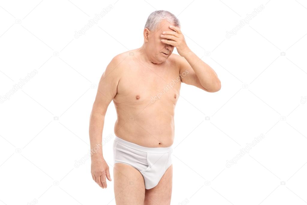 Upset senior man in underwear - Stock Photo, Image. 